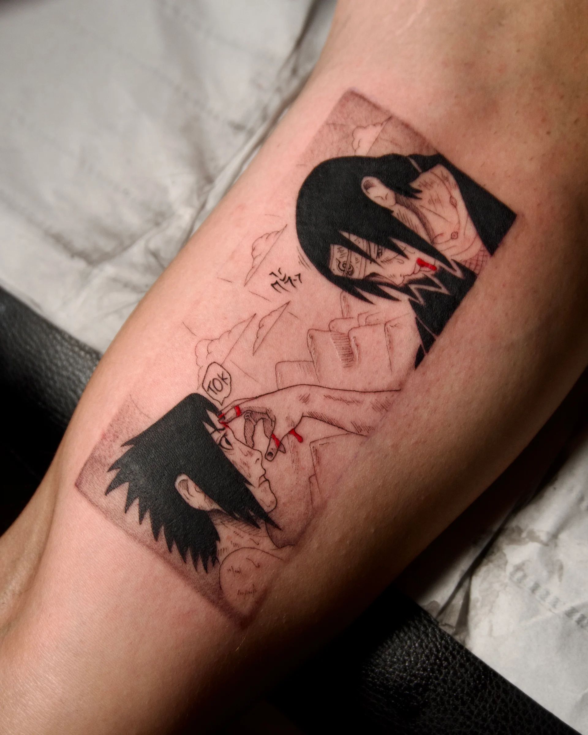 Naruto manga panels on the forearm