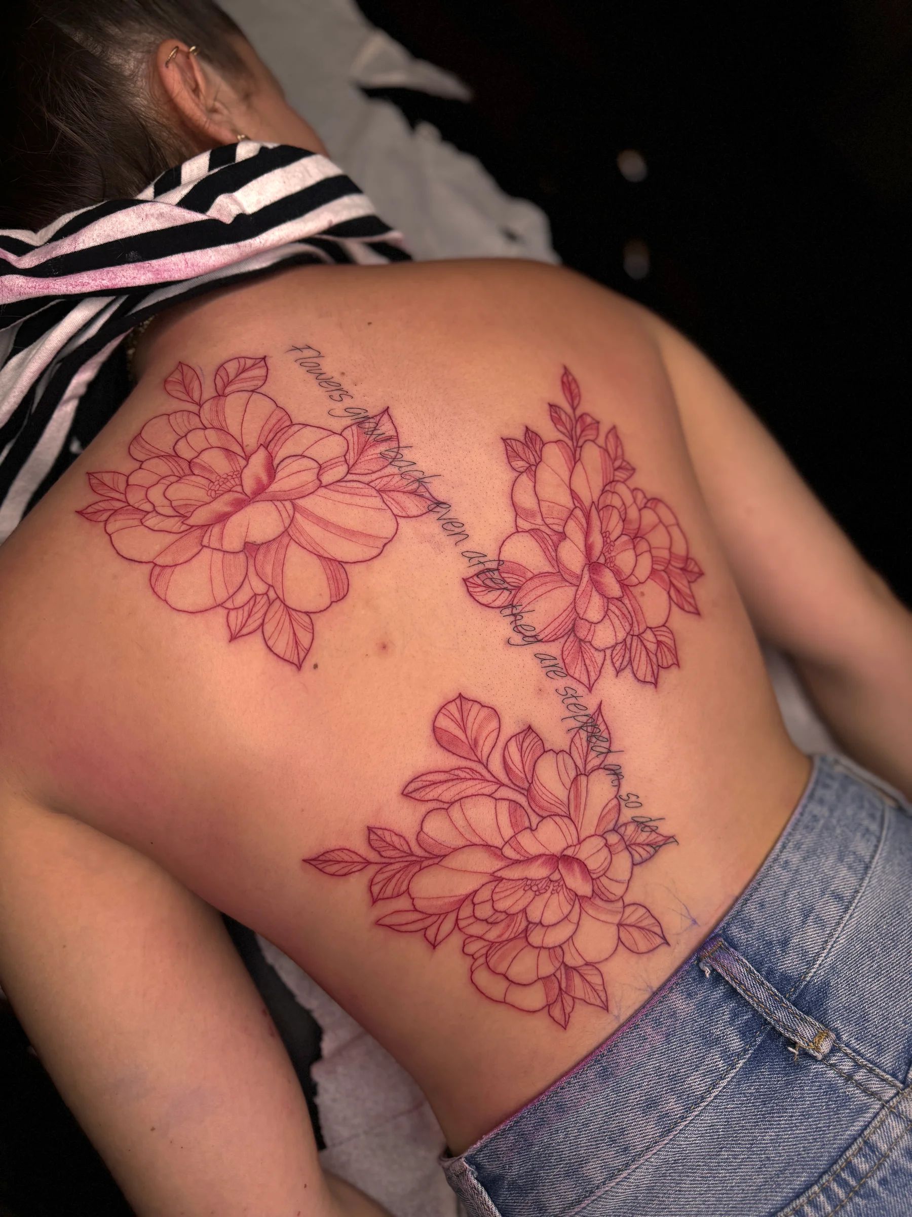 Red peonies with a phrase on the back