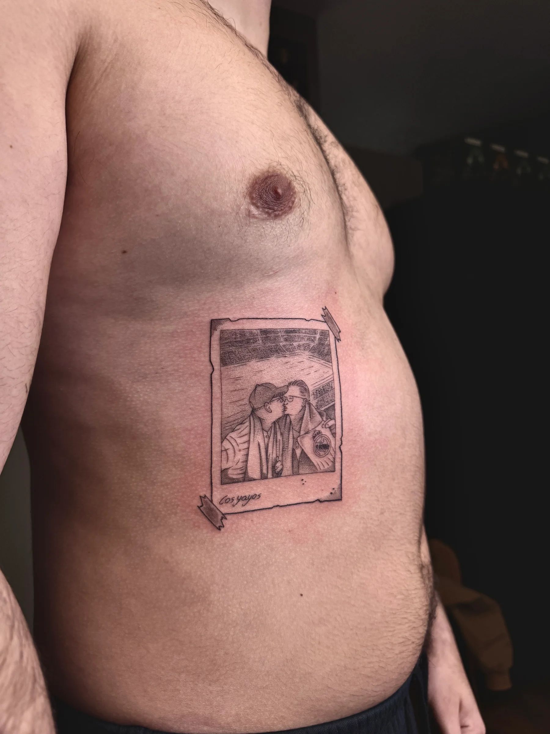 A couple's photo in a frame, on the ribs