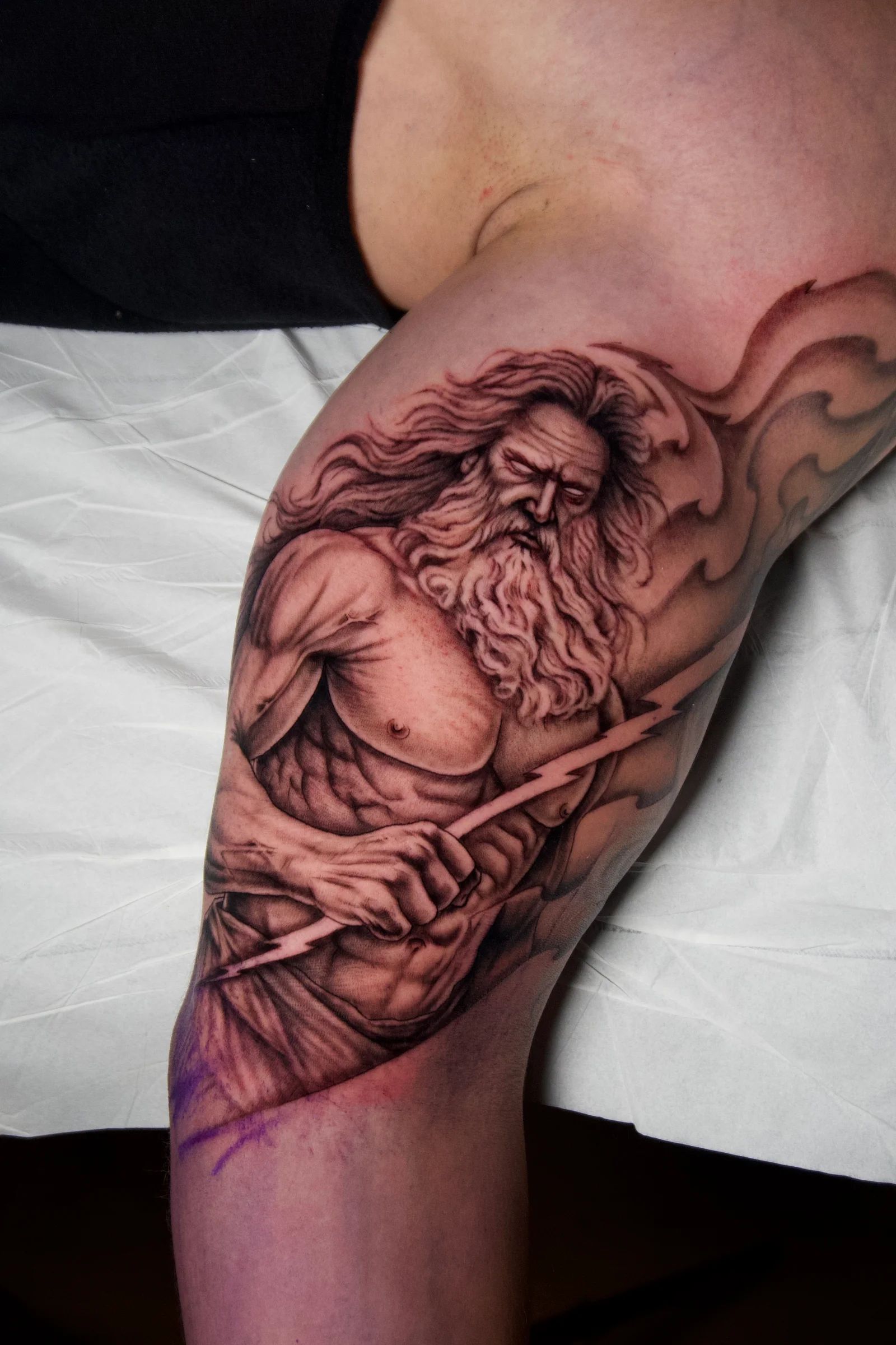 Poseidon with his trident on the arm