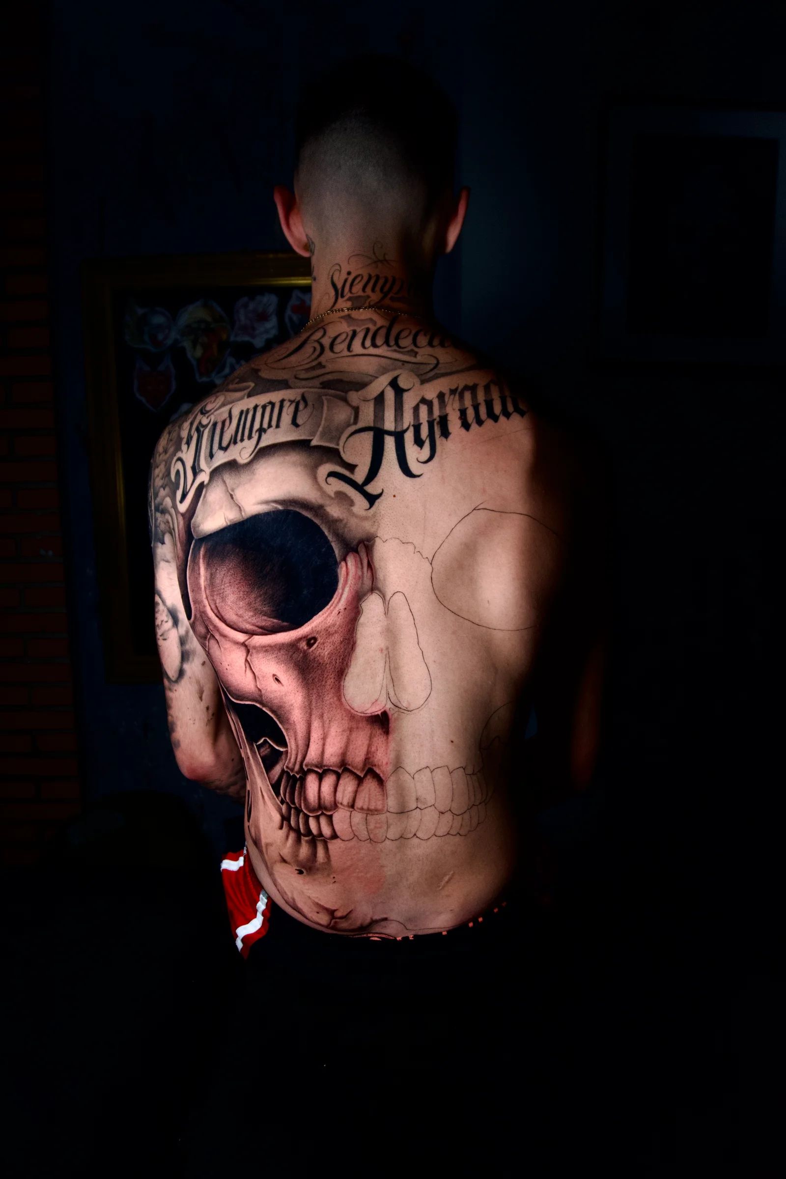 Skull across the whole back, with lettering above