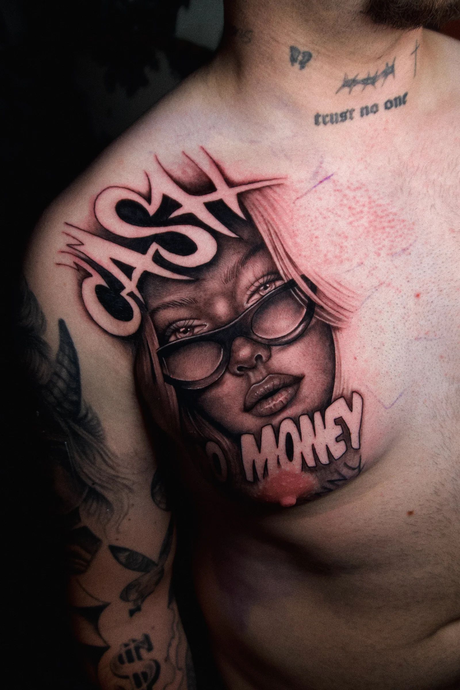 Woman with glasses and the words Cash and Money on the chest